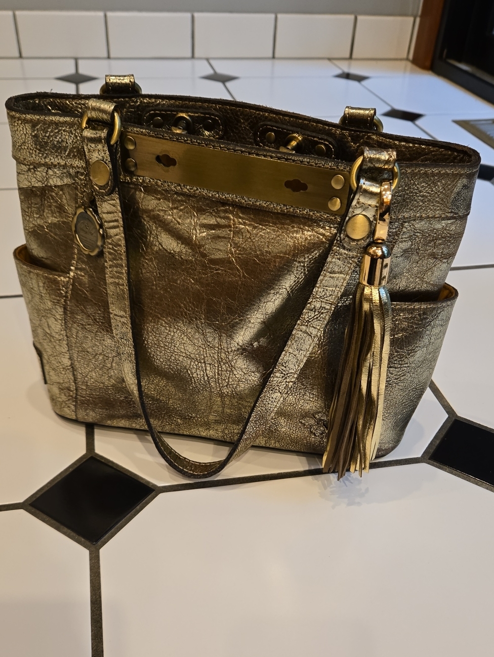 Patricia Nash 10 Year Anniversary Metallic Gold Women’s Tote Bag with Tassel